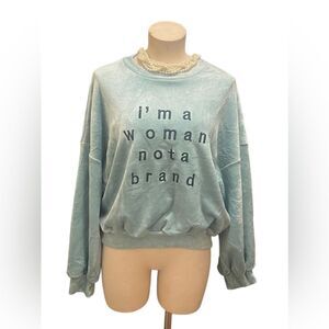 Bold Statement: Red Star “I’m a Woman Not a Brand” Crew Neck Sweater